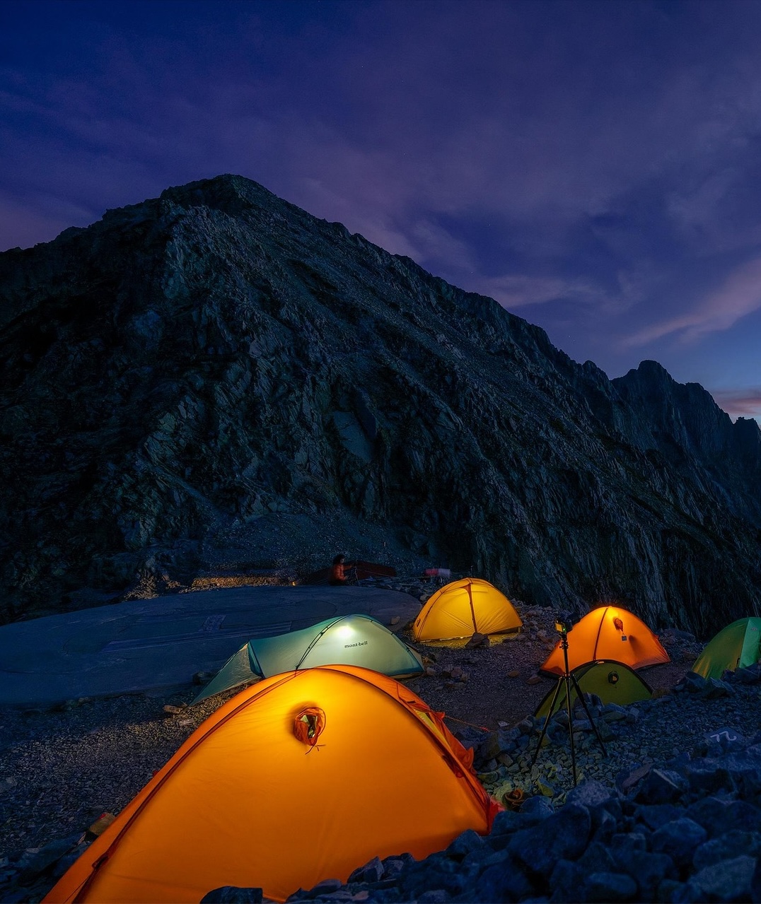 Tents on a mountain representing navigating research terrain